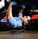 A mechanic working under a car